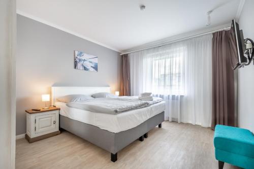 Postel nebo postele na pokoji v ubytování Seegarten Appartements Büsum