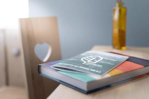 a book sitting on top of a table at Gartenhotel Fettehenne in Erkrath