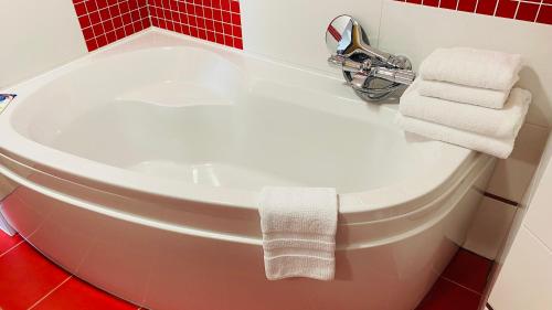 a bathroom with a white toilet and a sink at Penzion Pohoda in Trutnov