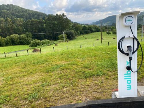 a gas station with a view of a field at Hotel Nafarrola - Gastronomy & Wine in Bermeo