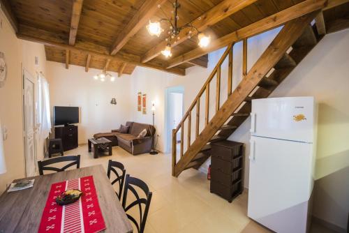 Телевизор и/или развлекательный центр в Villa ARETOUSA - Cretan Hospitality