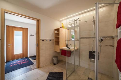a bathroom with a shower and a sink at Ferienwohnung Haus Fliri in Melago