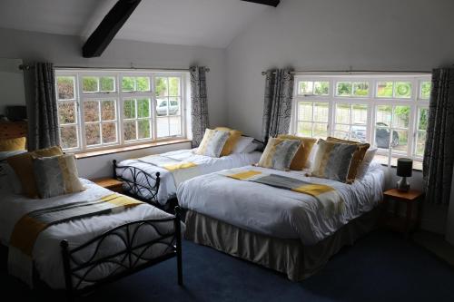 מיטה או מיטות בחדר ב-The Hostelrie at Goodrich