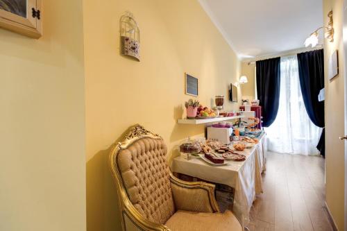 a dining room with a table with food on it at La Reggia dei Principi in Rome