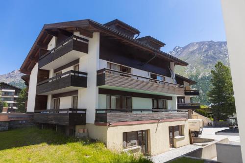 a building with balconies on the side of it at Haus Slalom in Saas-Fee