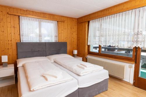 Una cama o camas en una habitación de Haus Slalom