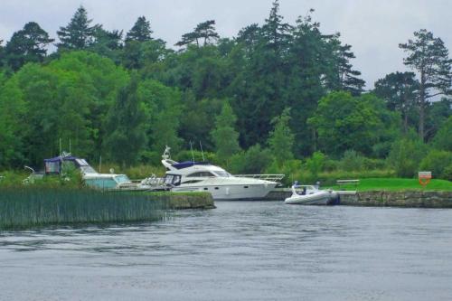 a group of boats are docked on a river at Old Court Holiday Homes Terryglass 4 Bed No 12 by Trident Holiday Homes in Terryglass