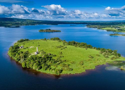 an island in the middle of a body of water at Old Court Holiday Homes Terryglass 4 Bed No 12 by Trident Holiday Homes in Terryglass
