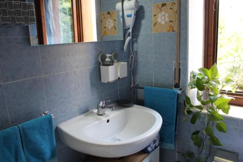 a bathroom with a sink and a mirror at Raphael's in Verona Locazione turistica in Verona