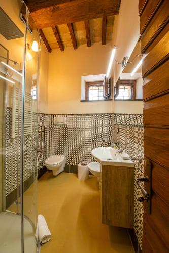 a bathroom with a sink and a toilet and a shower at Borgo Incantato Spoleto in Pompagnano