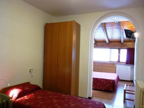Ліжко або ліжка в номері Hotel La Rosa