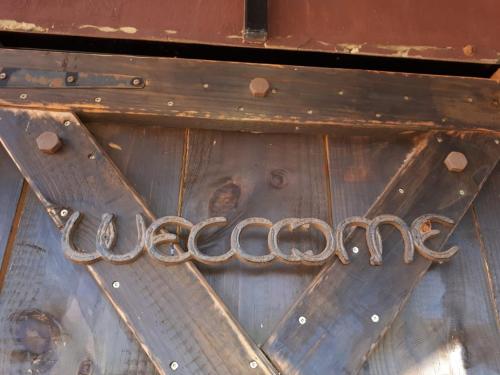 a metal door with a chain on the side of it at ThabaNkwe Bushveld Inn in Thabazimbi
