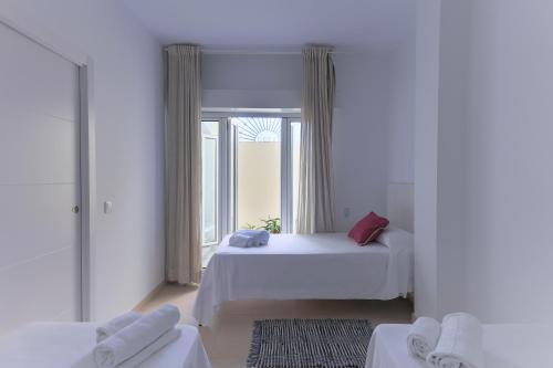 Postel nebo postele na pokoji v ubytování Apartamentos Homing Puerto Sherry