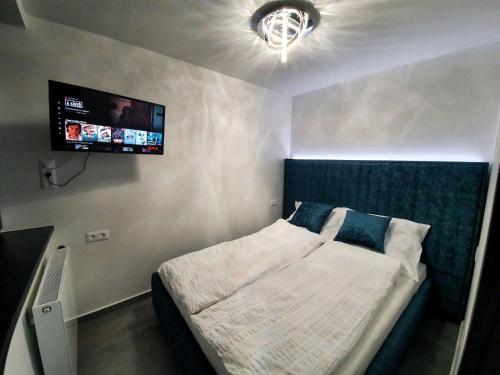 Postel nebo postele na pokoji v ubytování Positano Apartman