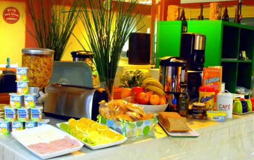 a counter topped with food on top of a table at Hostal Santa Catalina in Seville