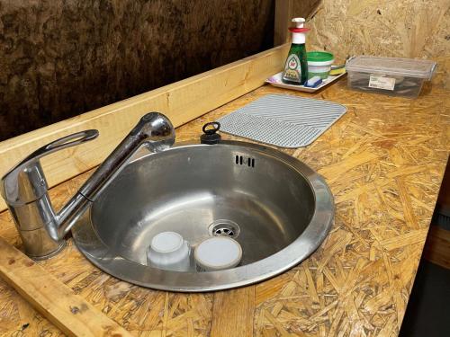 a kitchen sink with a faucet on a counter at Jeskyně Jánská in Janská