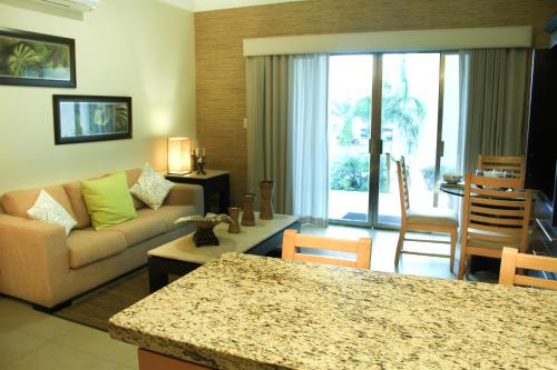 a living room with a couch and a table at Diamond Bay in Mazatlán