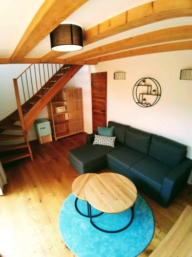 a living room with a couch and a table at Kafé Ořech in Mnichovo Hradiště