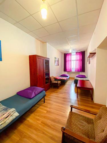 a room with several beds in a room at Schronisko Młodzieżowe PTSM "Alko" in Rzeszów
