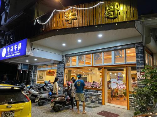 a man standing in front of a store at Niuge Minsu Homestay in Yuli