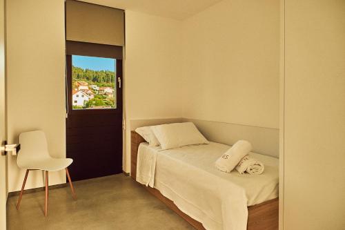 Posteľ alebo postele v izbe v ubytovaní Acíes Apartamentos Turísticos