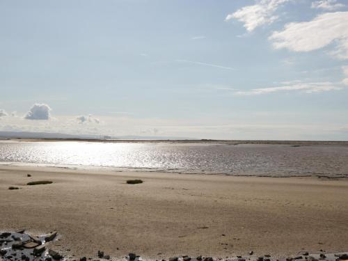 a sandy beach with a body of water at 14 Fairways in Burnham on Sea
