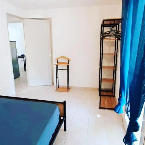 a bedroom with a bed and a ladder in a room at Gite Libecciu in Pietracorbara