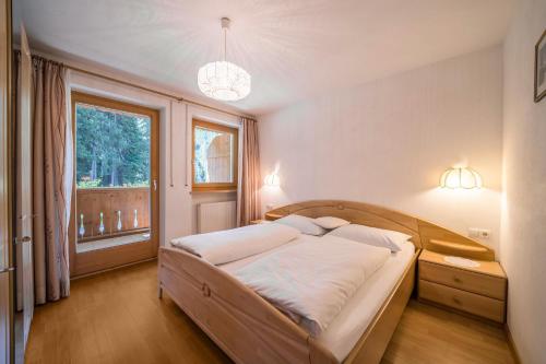 Кровать или кровати в номере Ferienhaus Maria Steinröserl