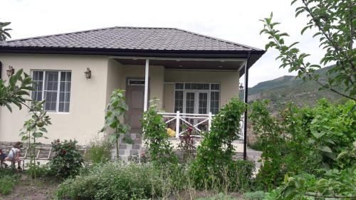 a house with a view of a mountain at Abbasov's guest house-In Lahij in Lahıc