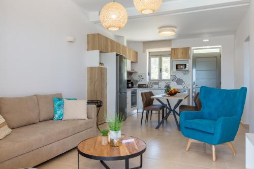 a living room with a couch and a table at Kallixeni Villas in Rethymno Town