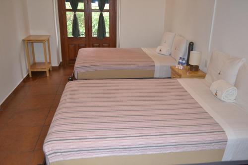a couple of beds in a room at Mexico City Hostel in Mexico City