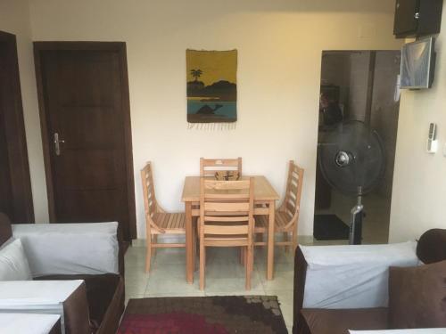 a room with a dining room table and chairs at Apartment in Luxor city center-Nil in Luxor