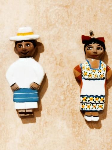 two lego figurines of two people on a wall at Hotel Barrio Latino in Playa del Carmen