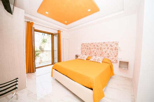 Ένα ή περισσότερα κρεβάτια σε δωμάτιο στο La Piazzetta Boutique Apartments