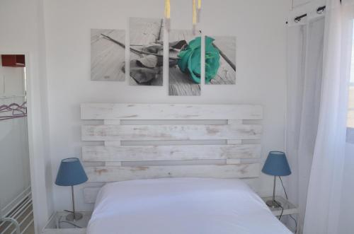 En eller flere senge i et værelse på BONITO ÁTICO AIRE ACONDICIONADO y BARBACOA