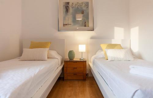Postel nebo postele na pokoji v ubytování B57 - Marachique 2 Bed Flat