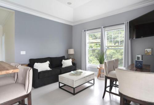 a living room with a couch and a table at The Cliffside Resort Condominiums in Greenport