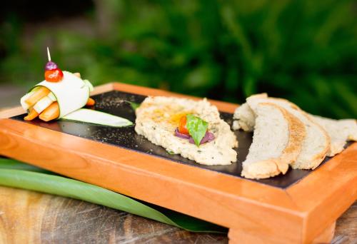 a plate of sushi on a wooden table at Bohemia Beach Tayrona in Guachaca