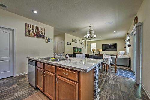 a kitchen with a sink and a counter top at Jax Home with Yard - 10 Mi to Adventure Landing! in Jacksonville