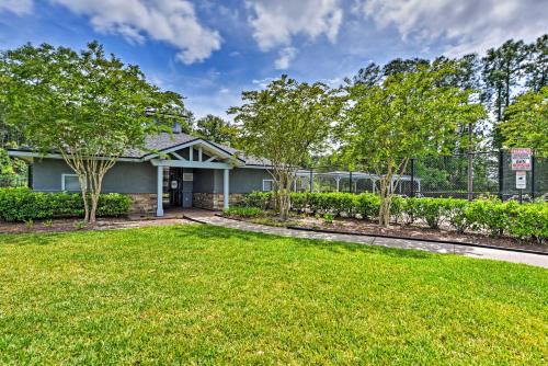 a house with a lawn in front of it at Jax Home with Yard - 10 Mi to Adventure Landing! in Jacksonville