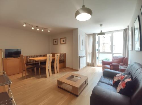 a living room with a couch and a table at Apartamento Libertad in Jaca