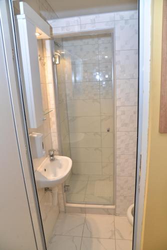 a bathroom with a shower and a sink at Casablanca in Niš