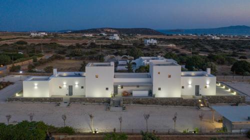 an aerial view of a white house at night at Bluebell Resort Villa SUNSET in Kampos Paros