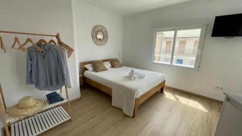 Postel nebo postele na pokoji v ubytování Mi Villa Apartamentos Dénia Centro