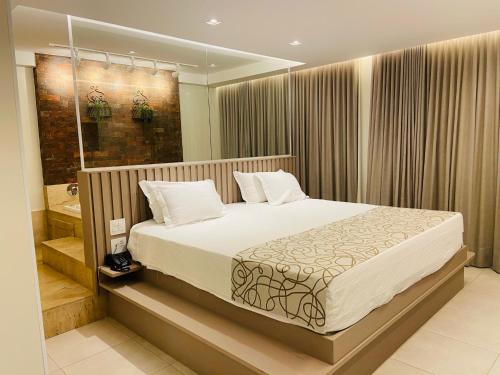 מיטה או מיטות בחדר ב-Go Inn Catalão