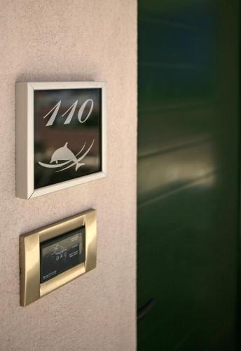 a door with a speed limit sign on it at Eurohotel Katrin Suites in Stalida