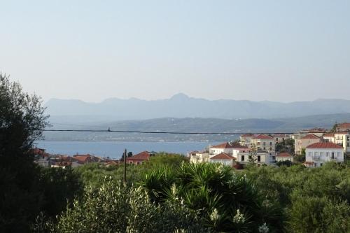 a view of a city and a body of water at Vasiliki Residence in Pylos
