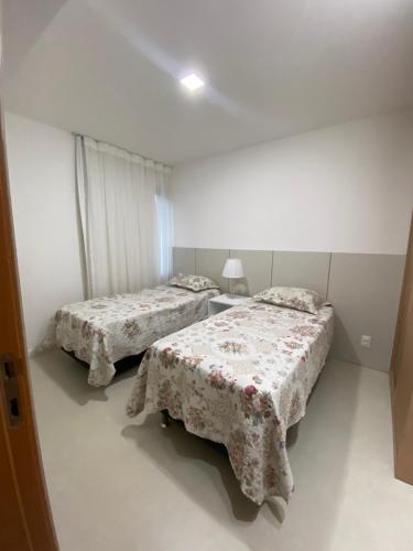 Ένα ή περισσότερα κρεβάτια σε δωμάτιο στο Residencial Ykutiba