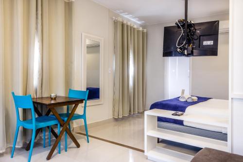 Ένα ή περισσότερα κρεβάτια σε δωμάτιο στο Injoy Suítes & Aparts
