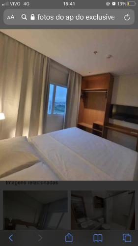 a picture of a bedroom with a bed and a window at Salinas Exclusive Resort in Salinópolis